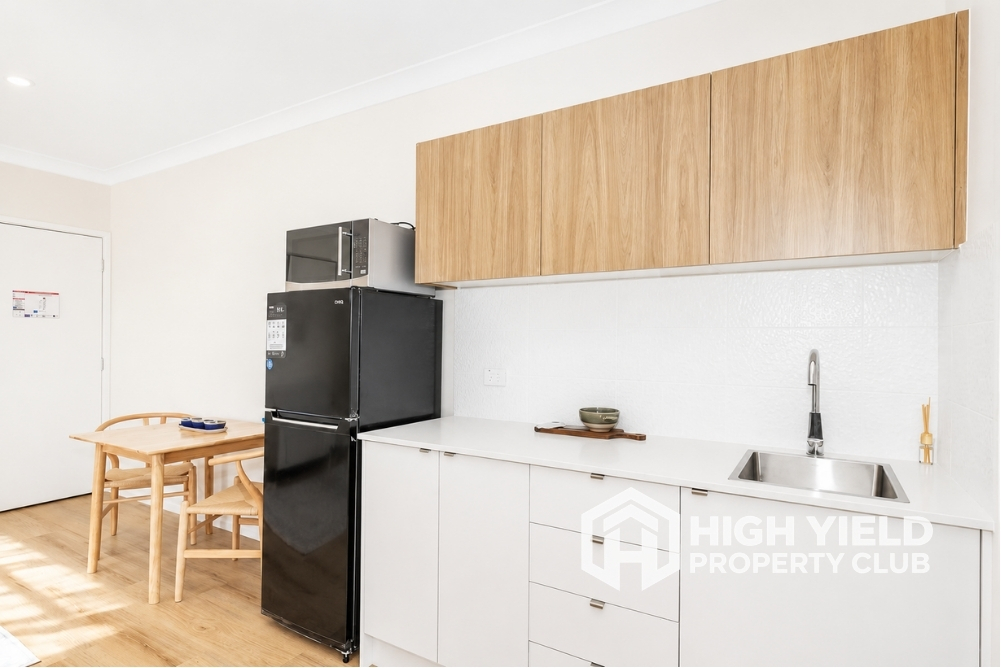 private kitchenette in a modern rooming house, best place to buy investment property