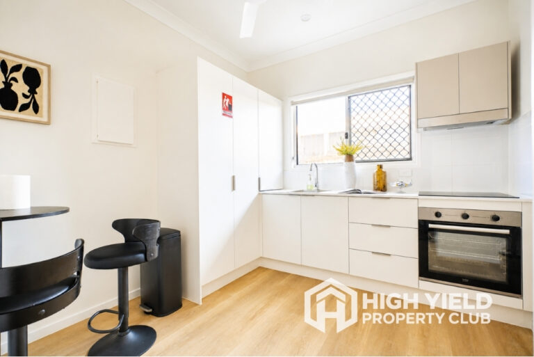 spacious common kitchen in a modern rooming house, the best property investment in Australia