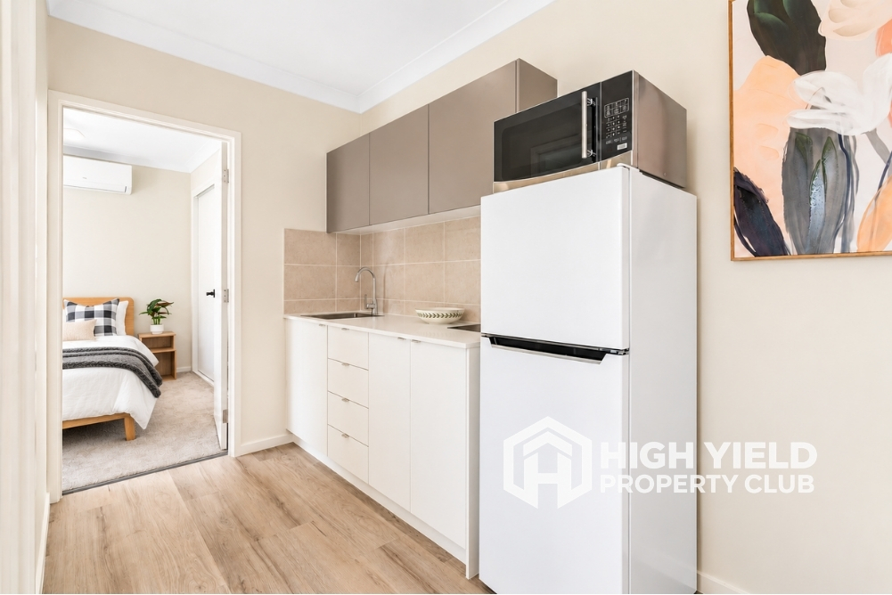 private kitchenette in a modern rooming house, a rental property